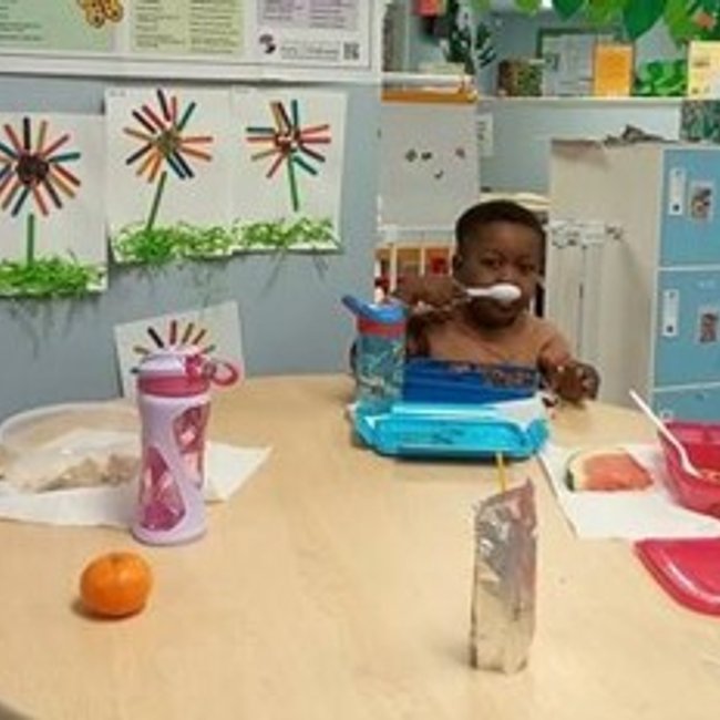 Children at a daycare near New Canaan CT enjoying lunch together.