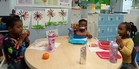 Children engaged in educational activities at a preschool near New Canaan, CT.