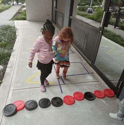Children engaging in outdoor play activities for kindergarten readiness at pre K near Glenbrook CT.