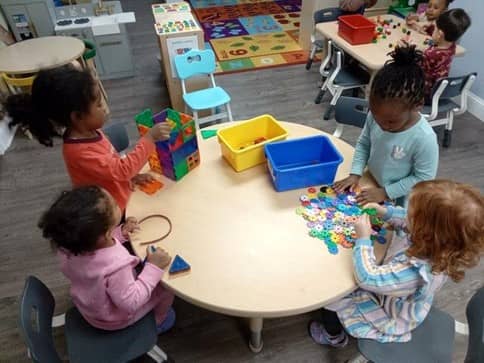 Children engaged in educational activities at a preschool near Glenbrook, CT.